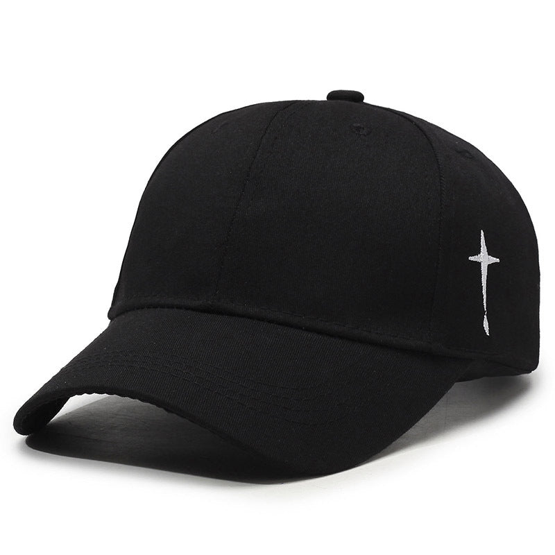 Washed cotton baseball cap with bold cross embroidery, curved brim, adjustable fit, street-style edge