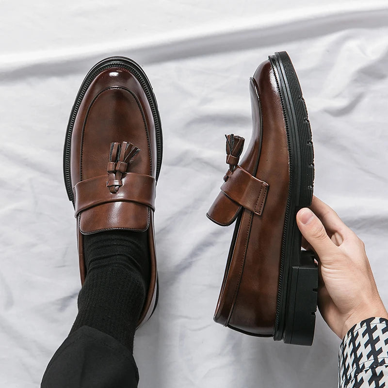 Men's brown genuine leather tassel loafers with hand-burnished finish and classic dress silhouette