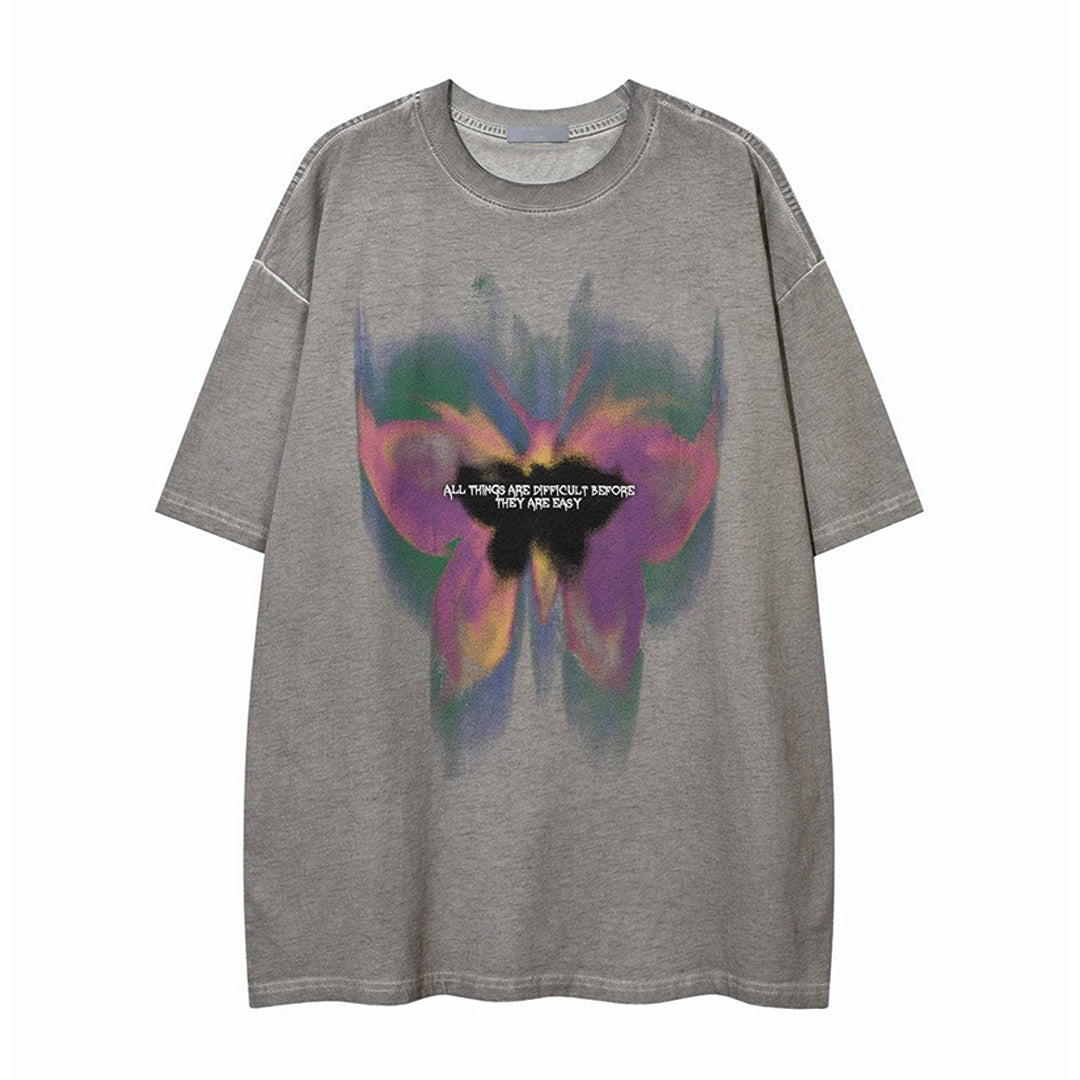 Vintage wash cotton relaxed fit t-shirt with hovering butterfly motif in faded nostalgic tones