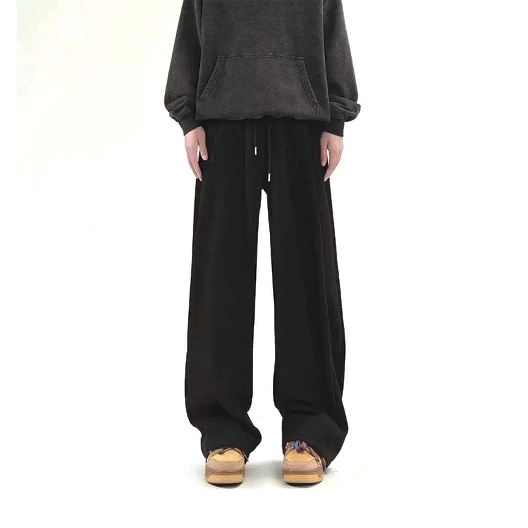 Gray wide-leg cotton sweatpants with elastic drawstring waist, relaxed lounge fit, raw minimalist hem