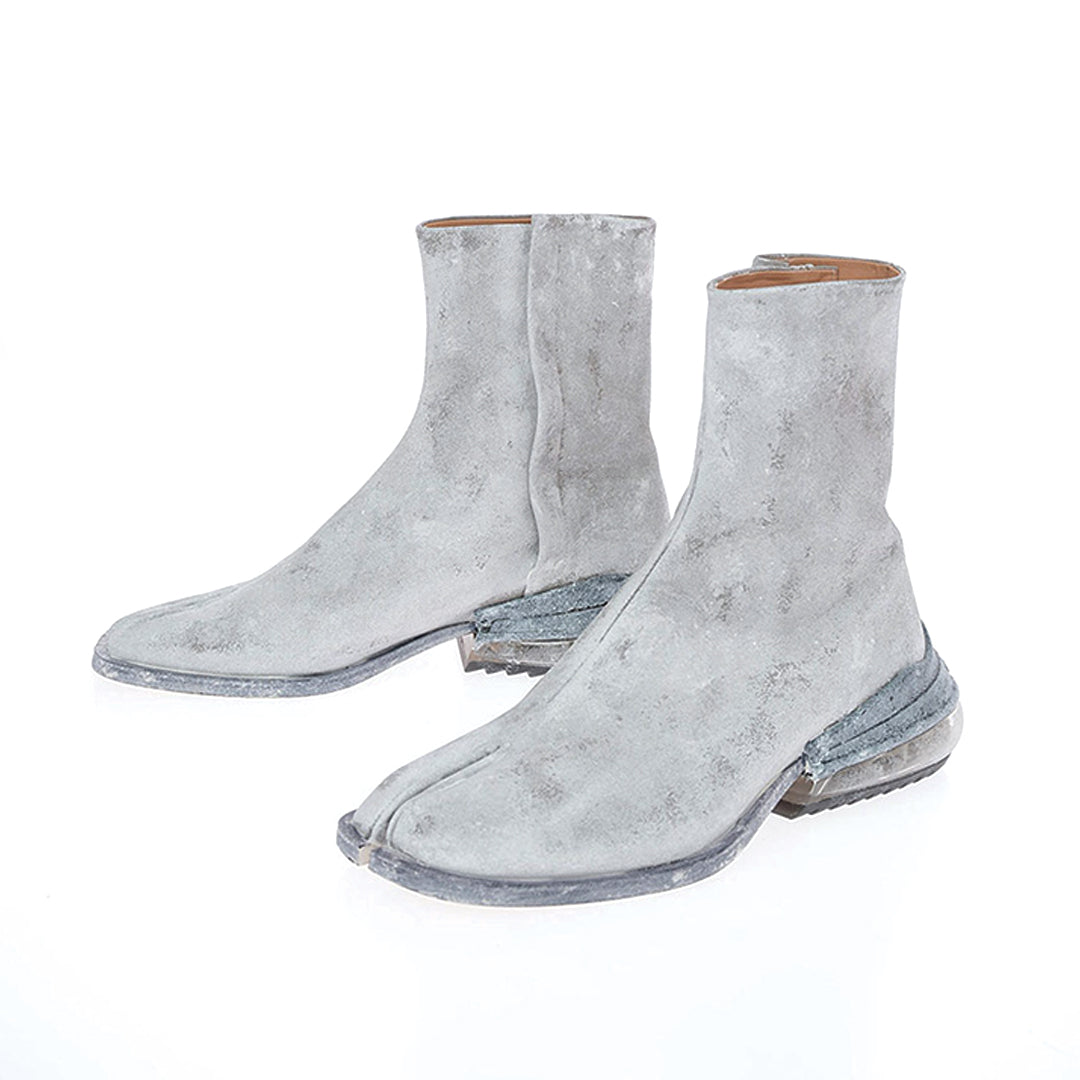 Black split-toe tabi leather boot with air-cushioned heel, urban fashion-forward silhouette