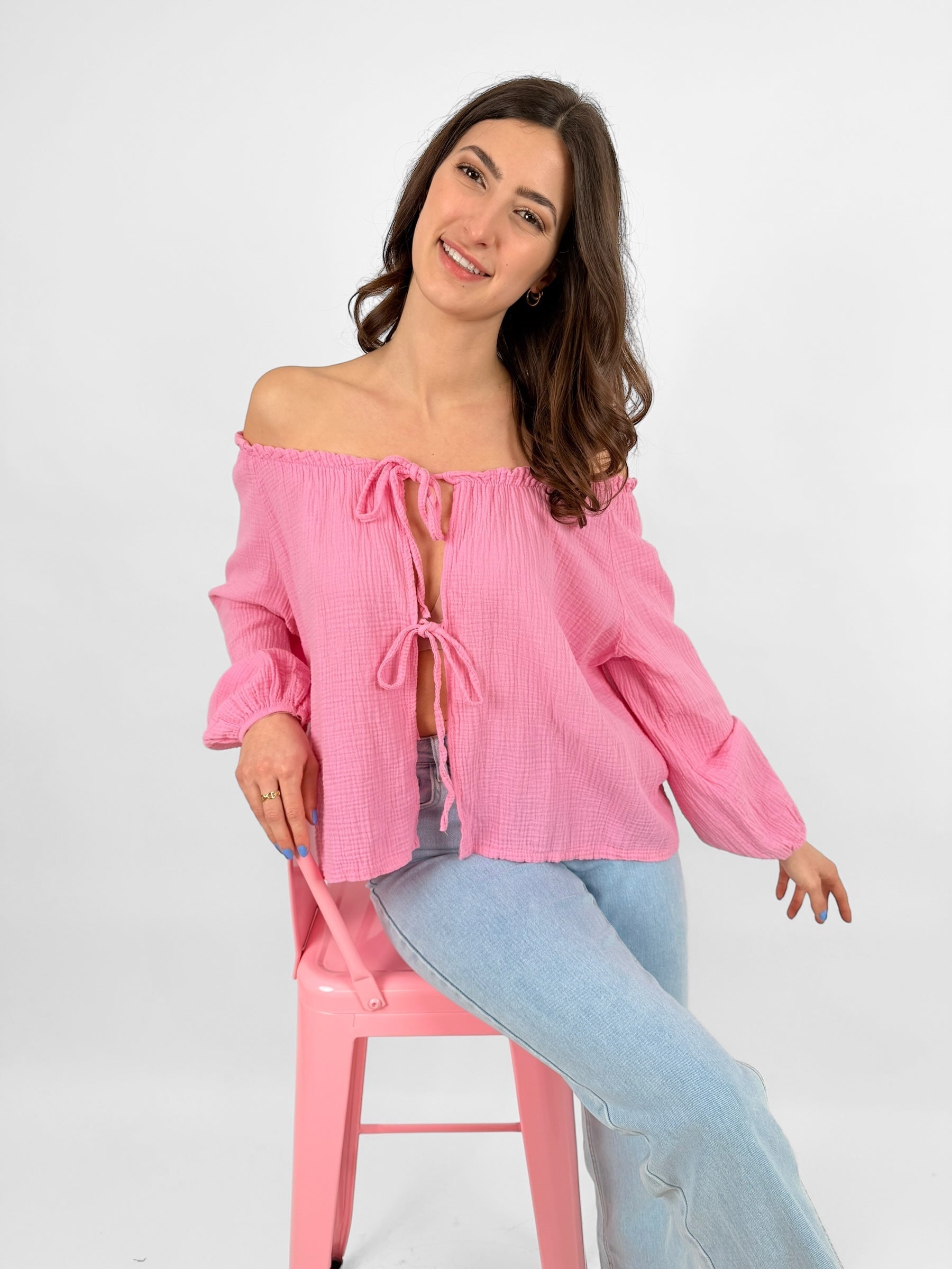 Women's white muslin blouse lightweight breathable fabric with delicate bow accents for everyday elegance