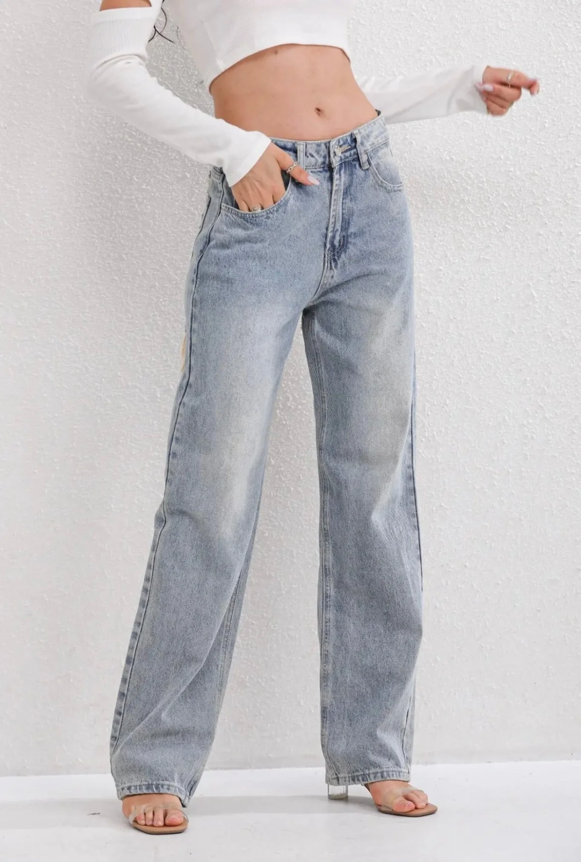 Straight leg distressed vintage denim jeans with cracked thigh accents for casual everyday wear