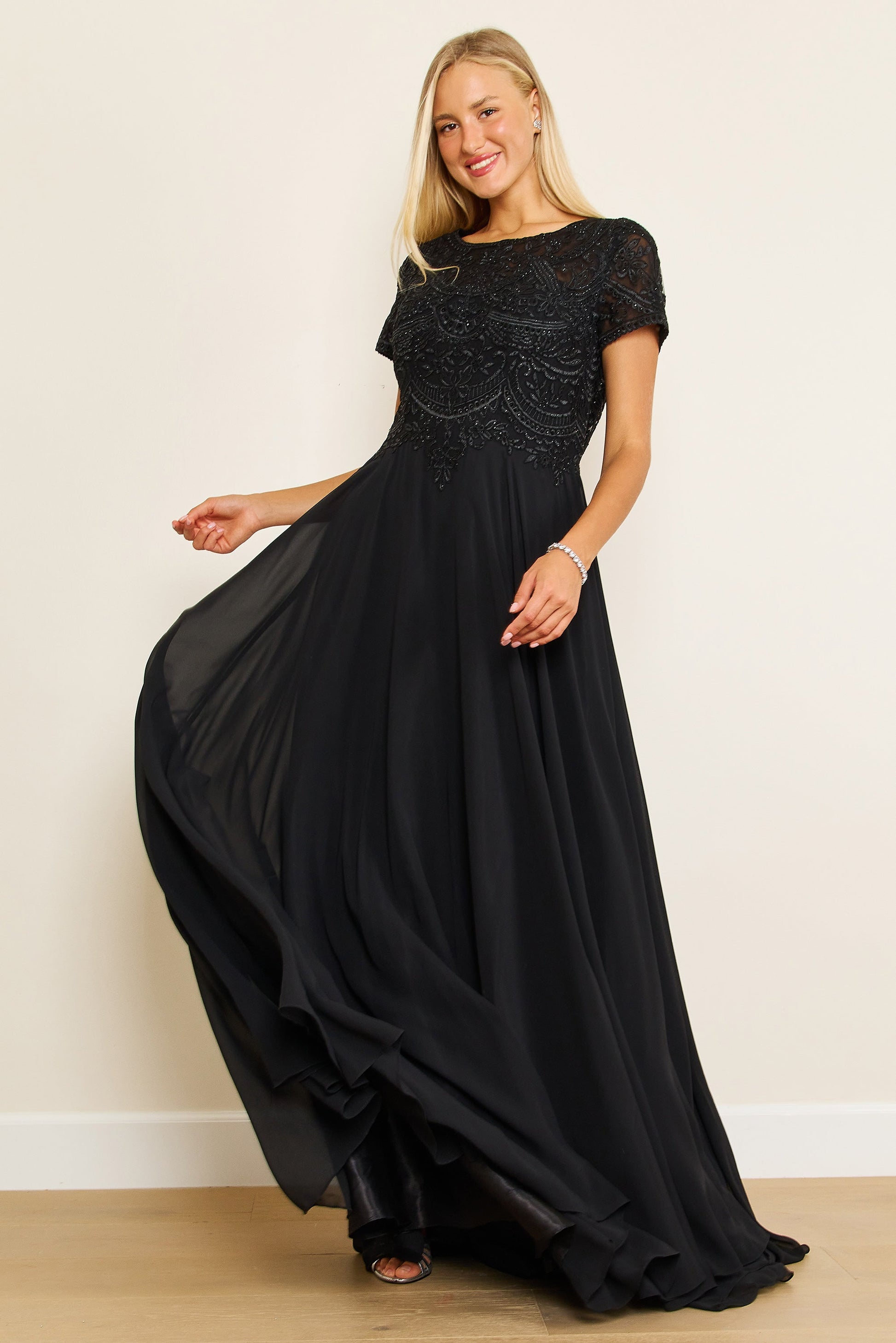 Elegant short sleeve chiffon mother of the bride dress in blush with diamond-embellished scoop neckline bodice