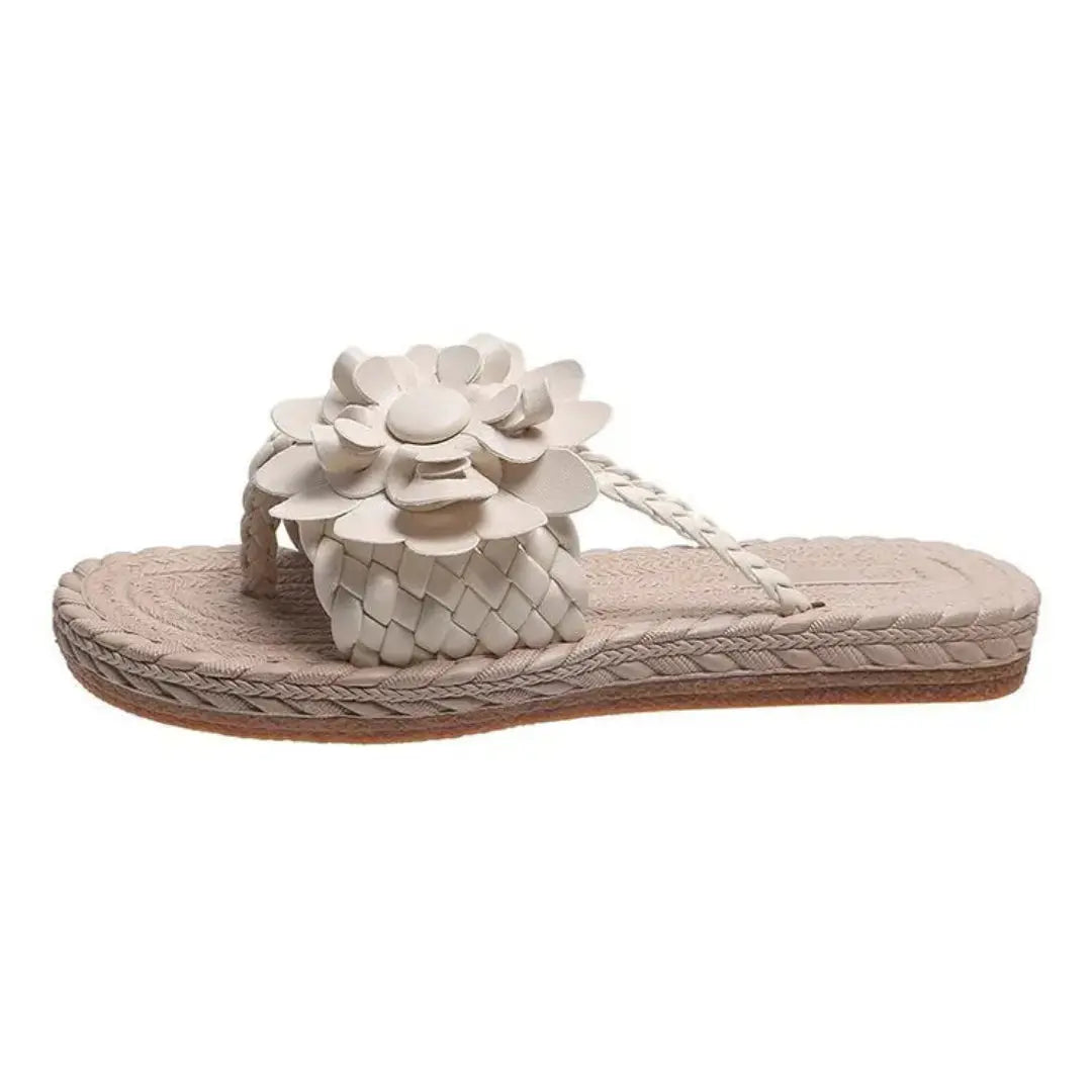 Women's beige woven slip-on flat sandals with bold 3D daisy floral appliqué embellishment