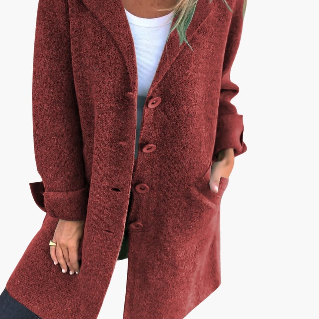 Women's long coat with notched lapel, button closure, side pockets, tailored silhouette for everyday elegance
