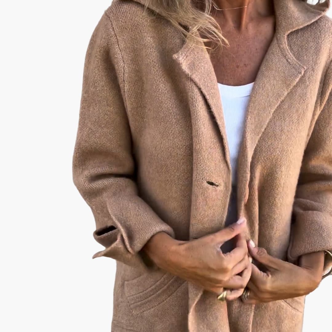 Women's long coat with notched lapel, button closure, side pockets, classic elegant everyday style