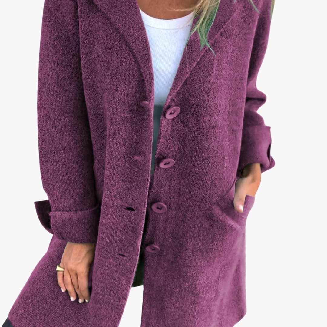 Women's long coat with notched lapel, button closure, side pockets, classic tailored everyday style