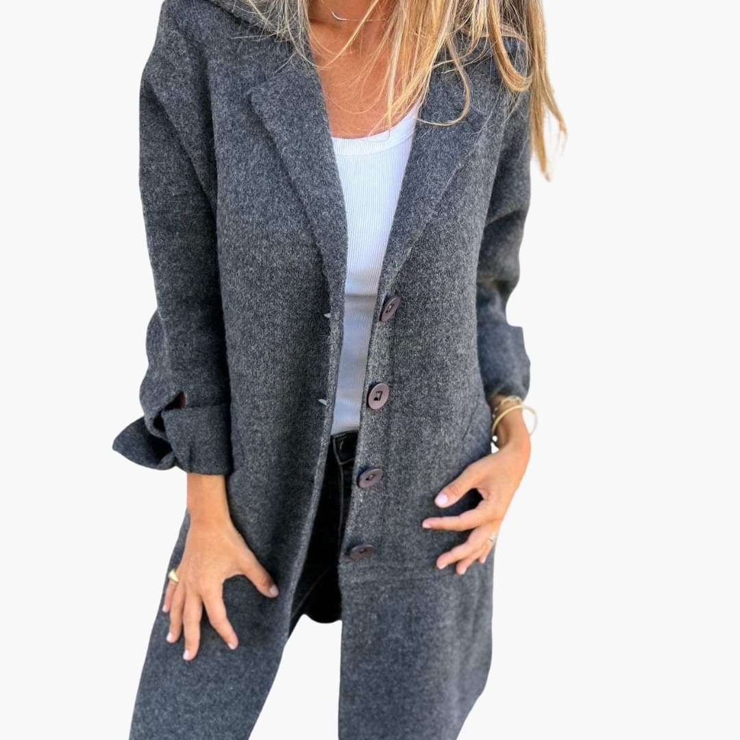 Women's long coat with notched lapel, button closure, side pockets, tailored silhouette for everyday elegance