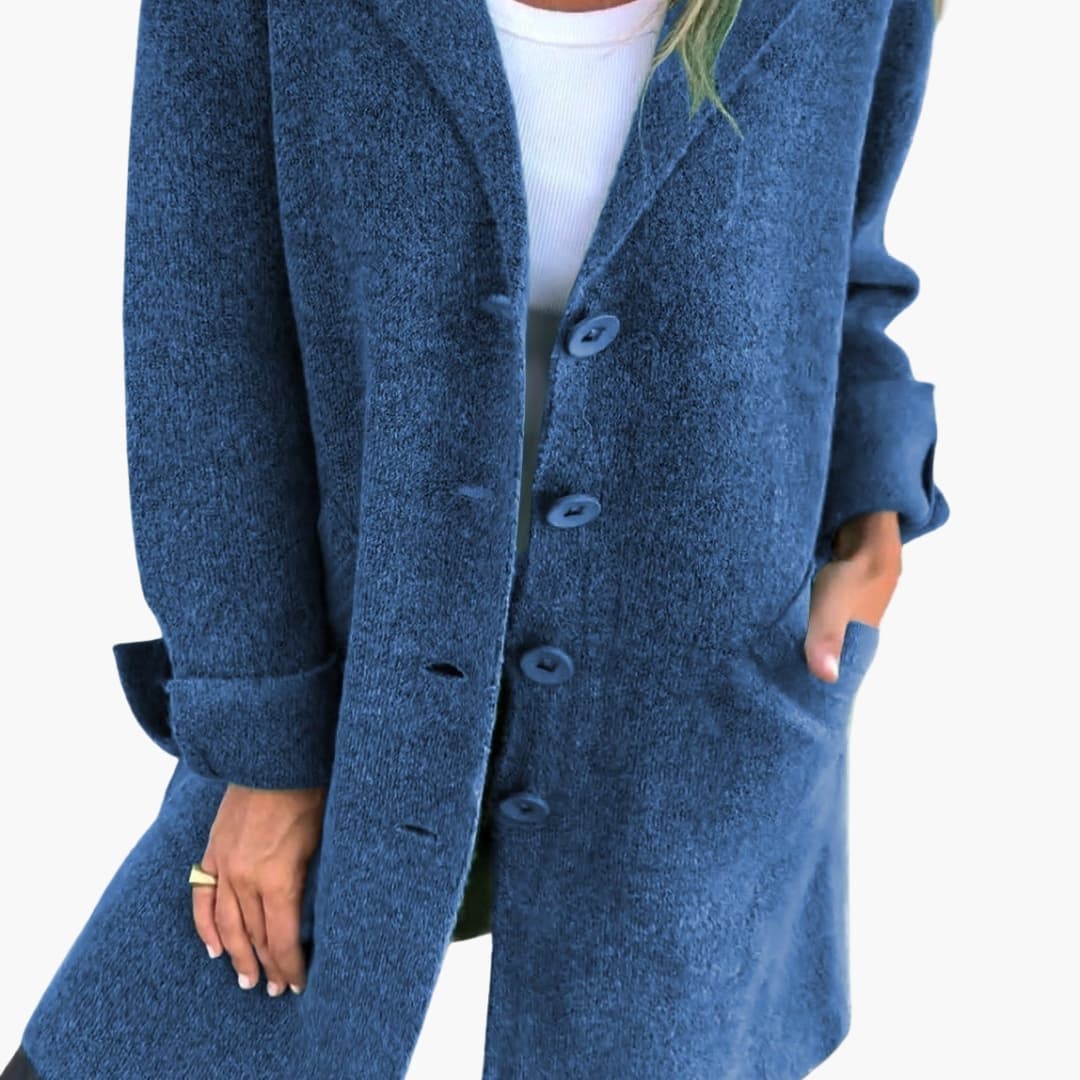 Women's long coat with notched lapel, button closure, side pockets, tailored silhouette for everyday elegance