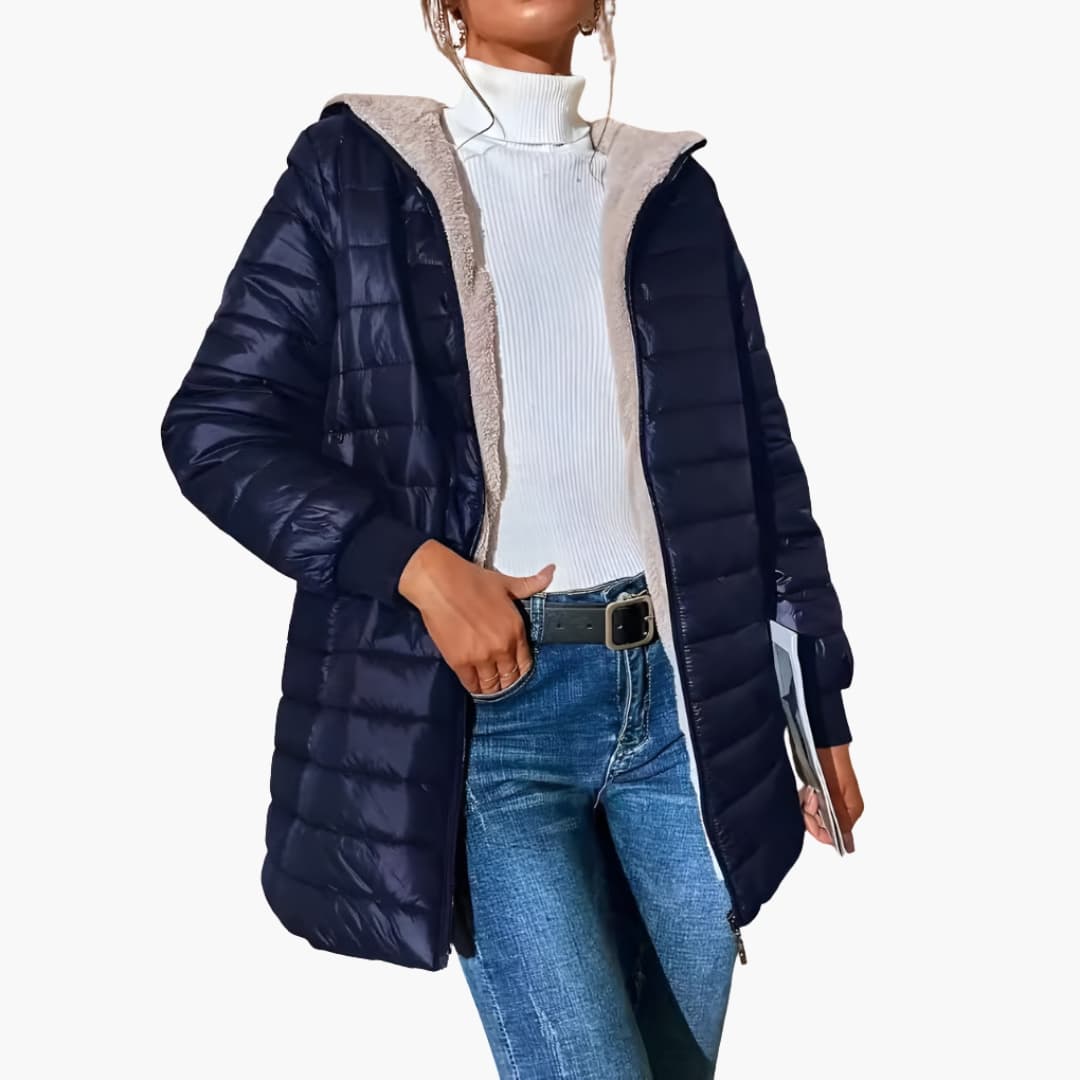 Women's longline quilted hooded coat with front zipper pockets and ribbed cuffs streamlined silhouette