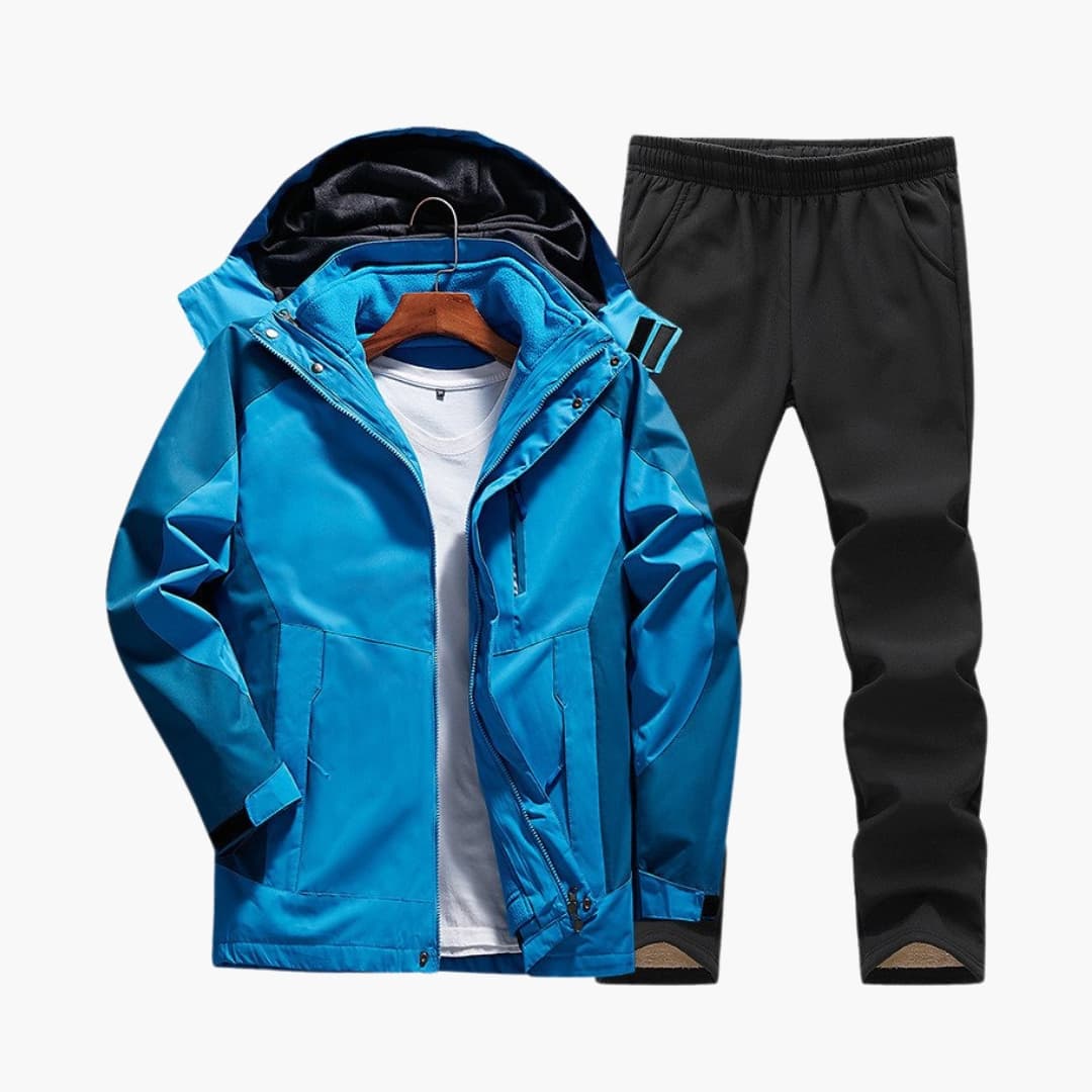 Women's hooded outdoor jacket and pants set in neutral tones with elastic waist and functional pockets
