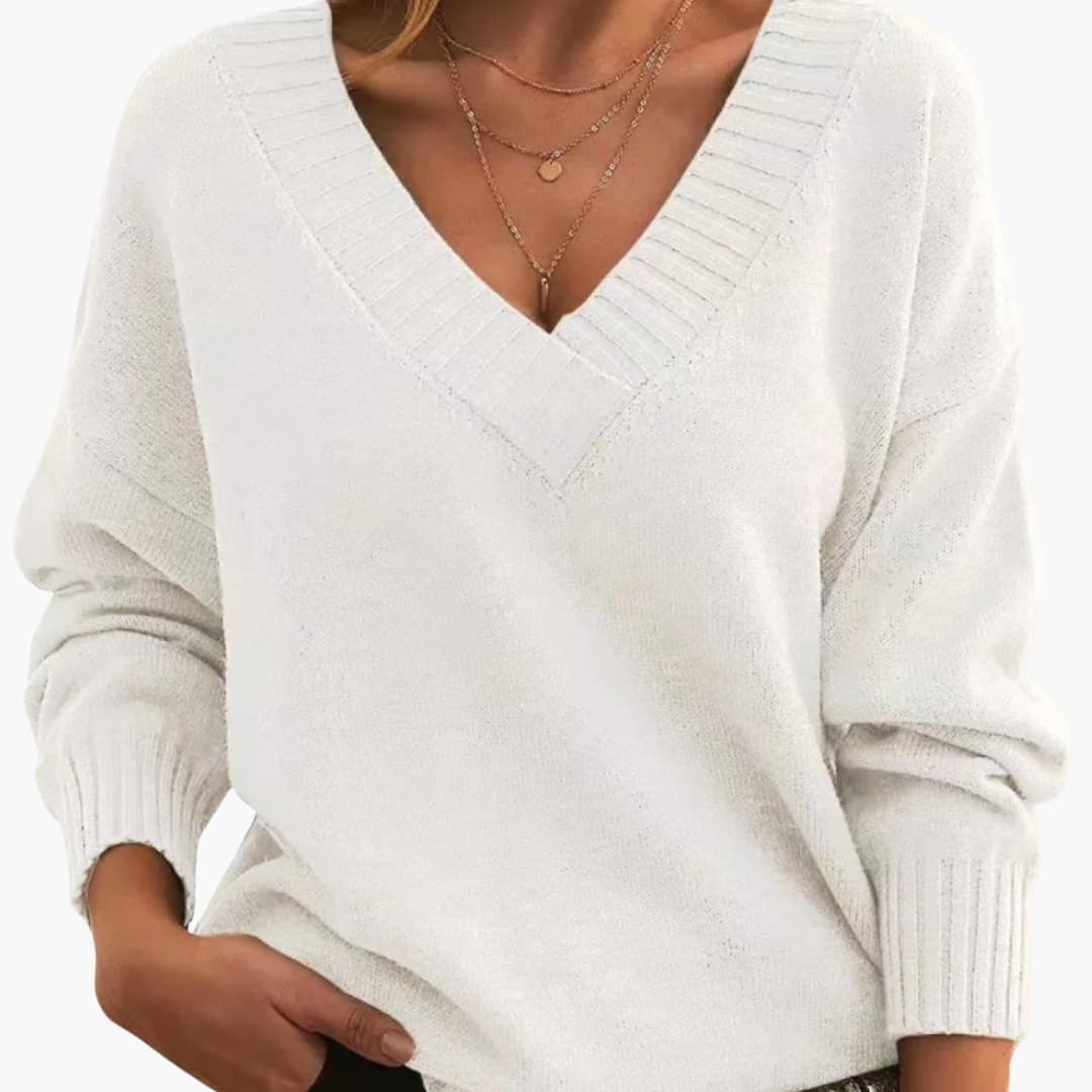 Women's oversized knit sweater deep V-neck ribbed cuffs relaxed pullover cozy casual style