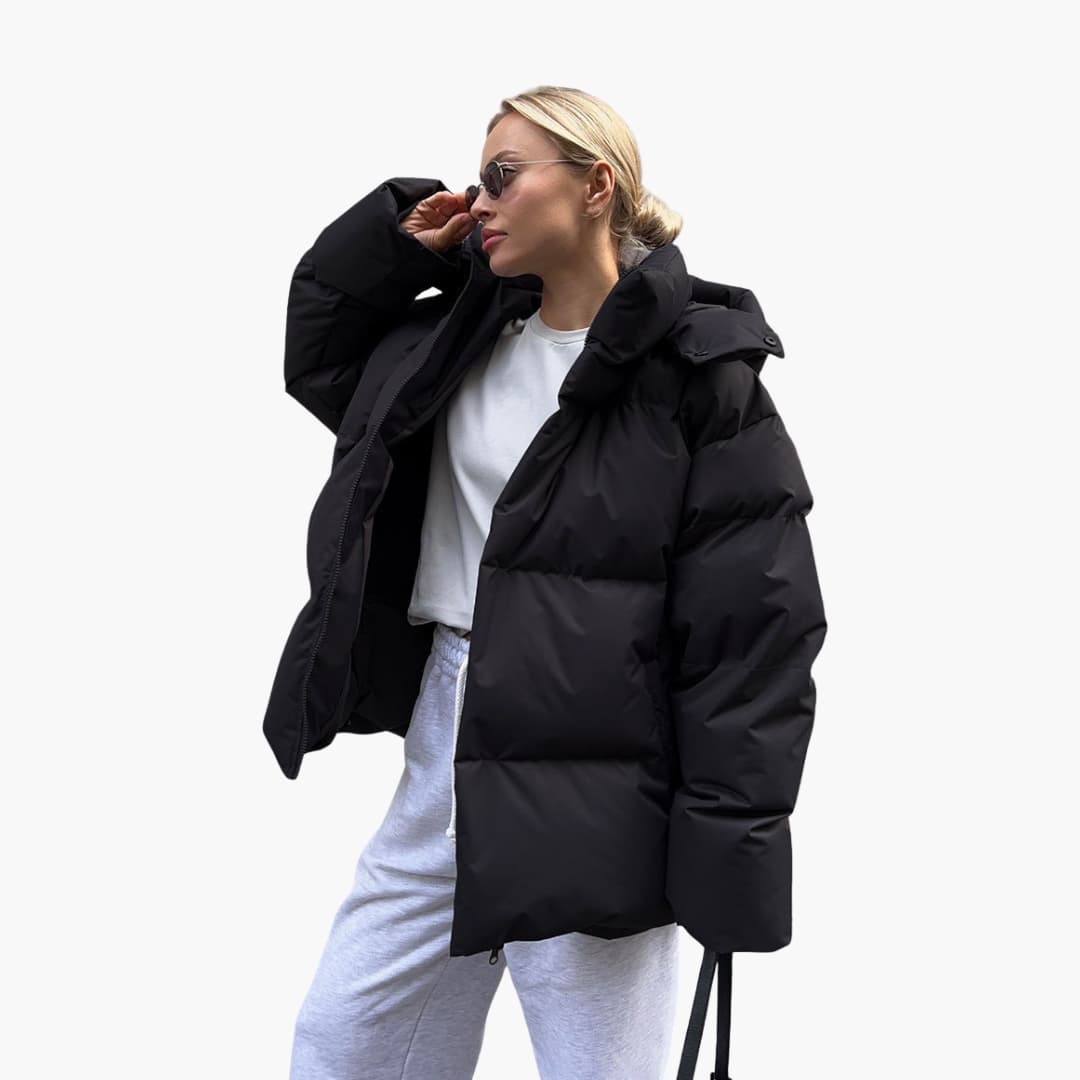 Women's quilted jacket with high collar and full-length zipper, hip-length cut for warm daily wear