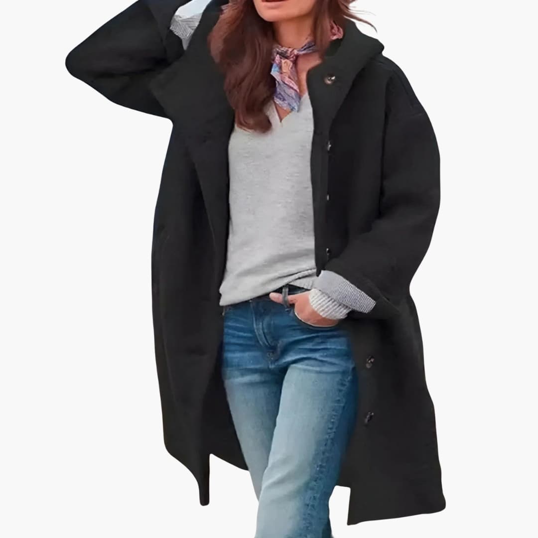 Women's knee-length winter coat with button closure, wide revers collar, and side pockets