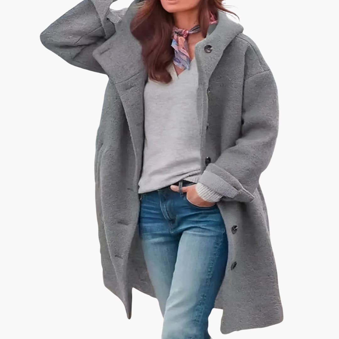 Women's long winter coat with button closure, knee-length silhouette, wide revers collar, and side pockets