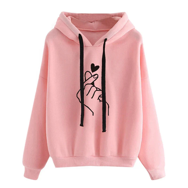 Women's cozy fleece hoodie in neutral tone with finger heart motif, relaxed fit with pockets