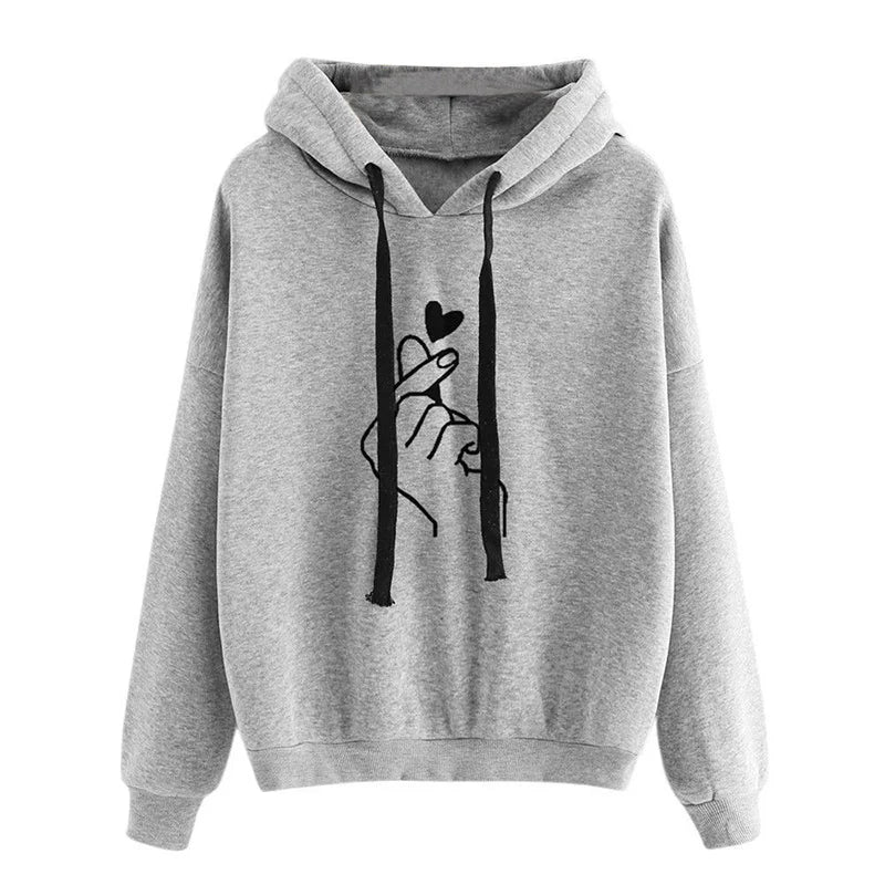 Women's cozy fleece hoodie with finger heart motif, soft plush fabric, kangaroo pockets, casual everyday style