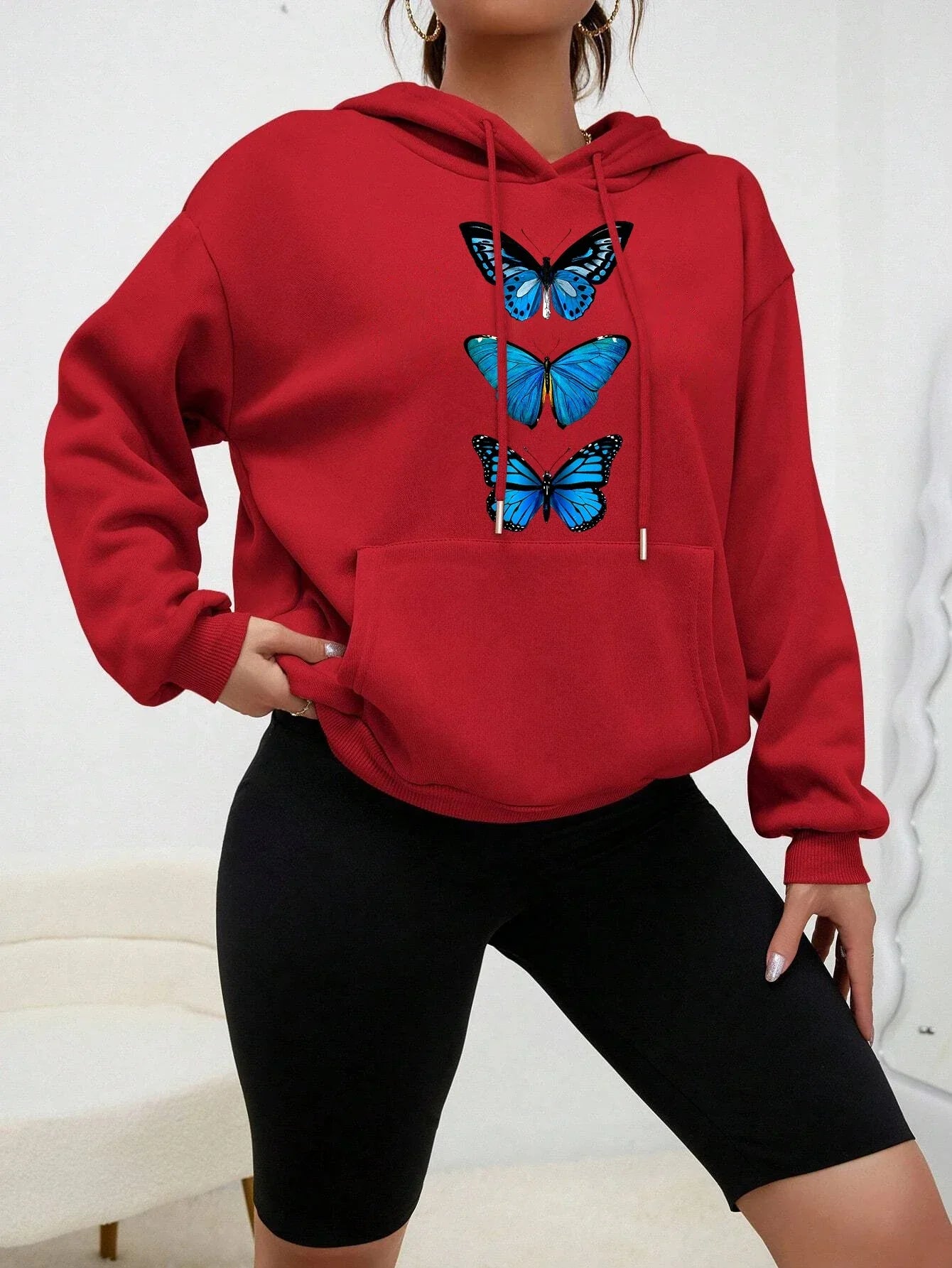 Women's cozy fleece hoodie with delicate butterfly print, designed for everyday casual warmth and style
