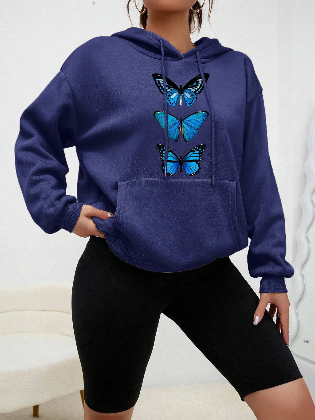 Women's cozy fleece hoodie with delicate butterfly print, casual everyday style, soft and warm