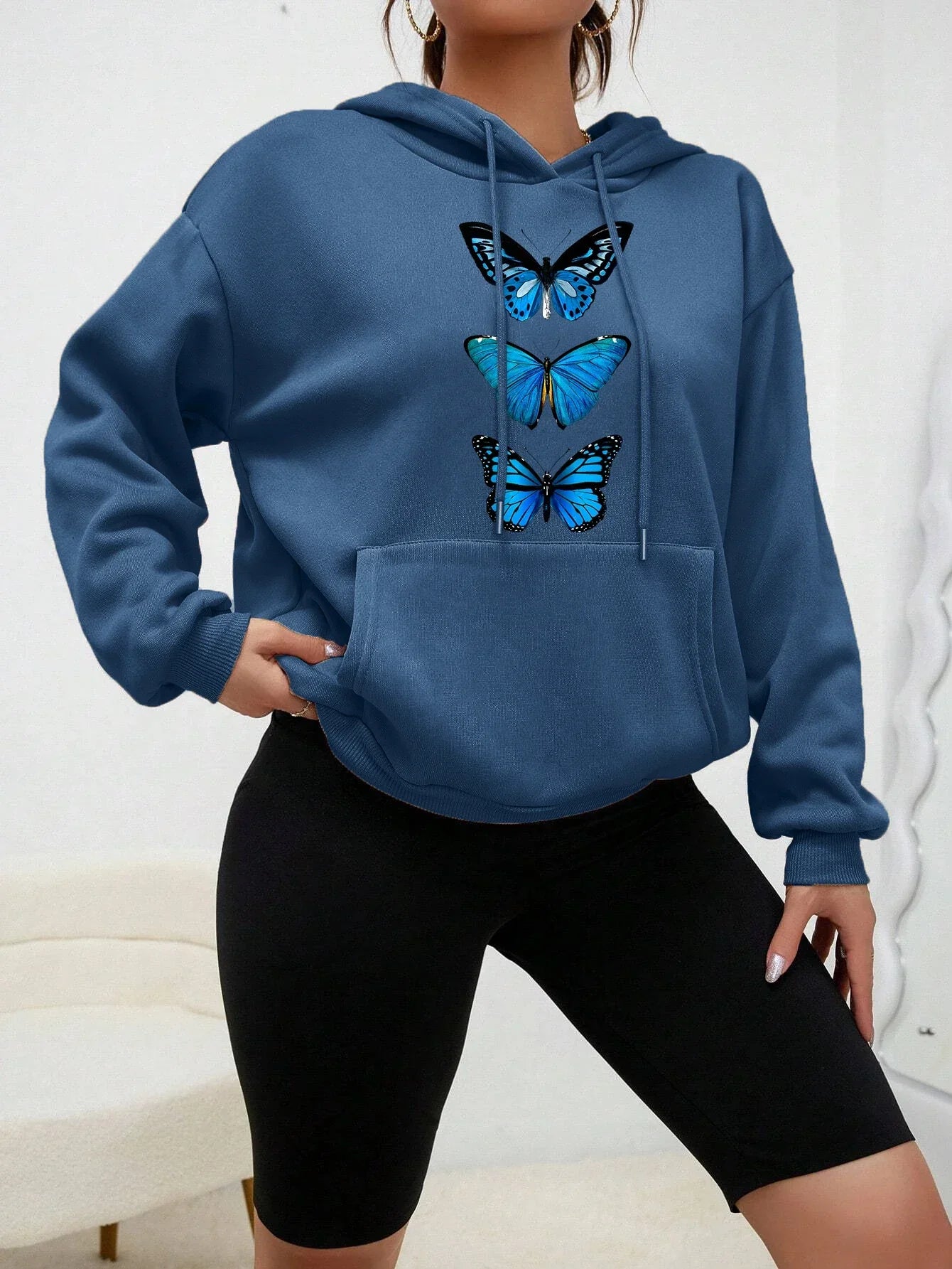 Women's cozy fleece hoodie with delicate butterfly print, casual everyday style, soft and warm