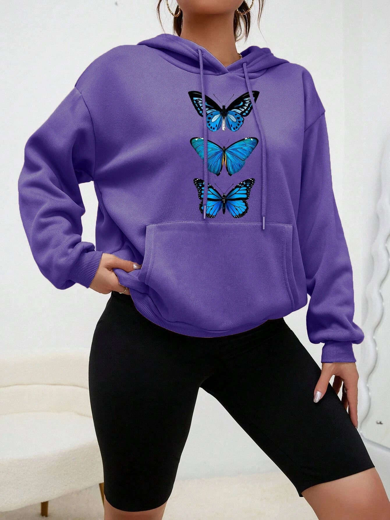 Women's cozy fleece hoodie with delicate butterfly print, soft premium fabric for everyday casual style