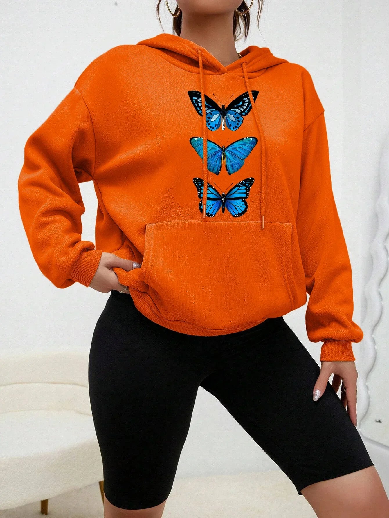 Women's cozy fleece hoodie with delicate butterfly print, casual everyday style, soft and warm