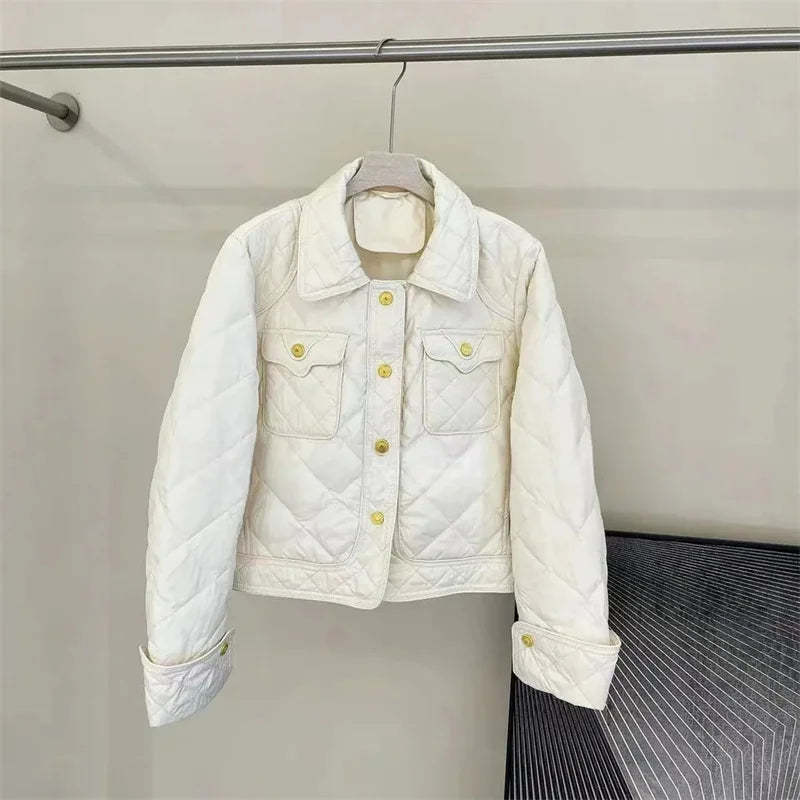 Women's lightweight cotton parka in neutral tone, warm down-filled winter jacket for cold weather outdoor activities