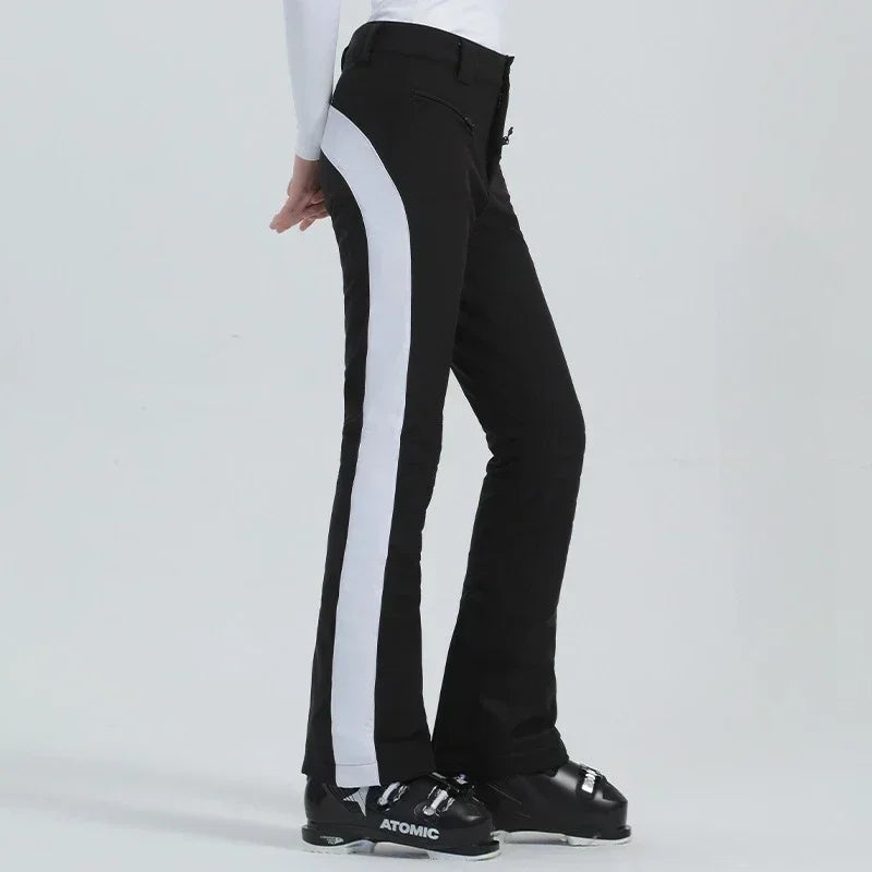 Women's slim fit ski pants waterproof fleece-lined polyester with high elasticity for winter slopes