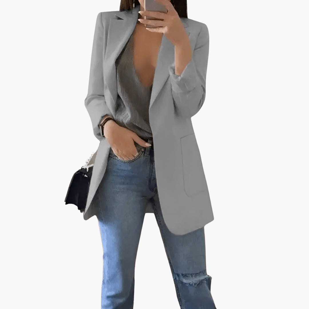 Women's open front blazer with structured lapel, long sleeves, pockets, polished professional style