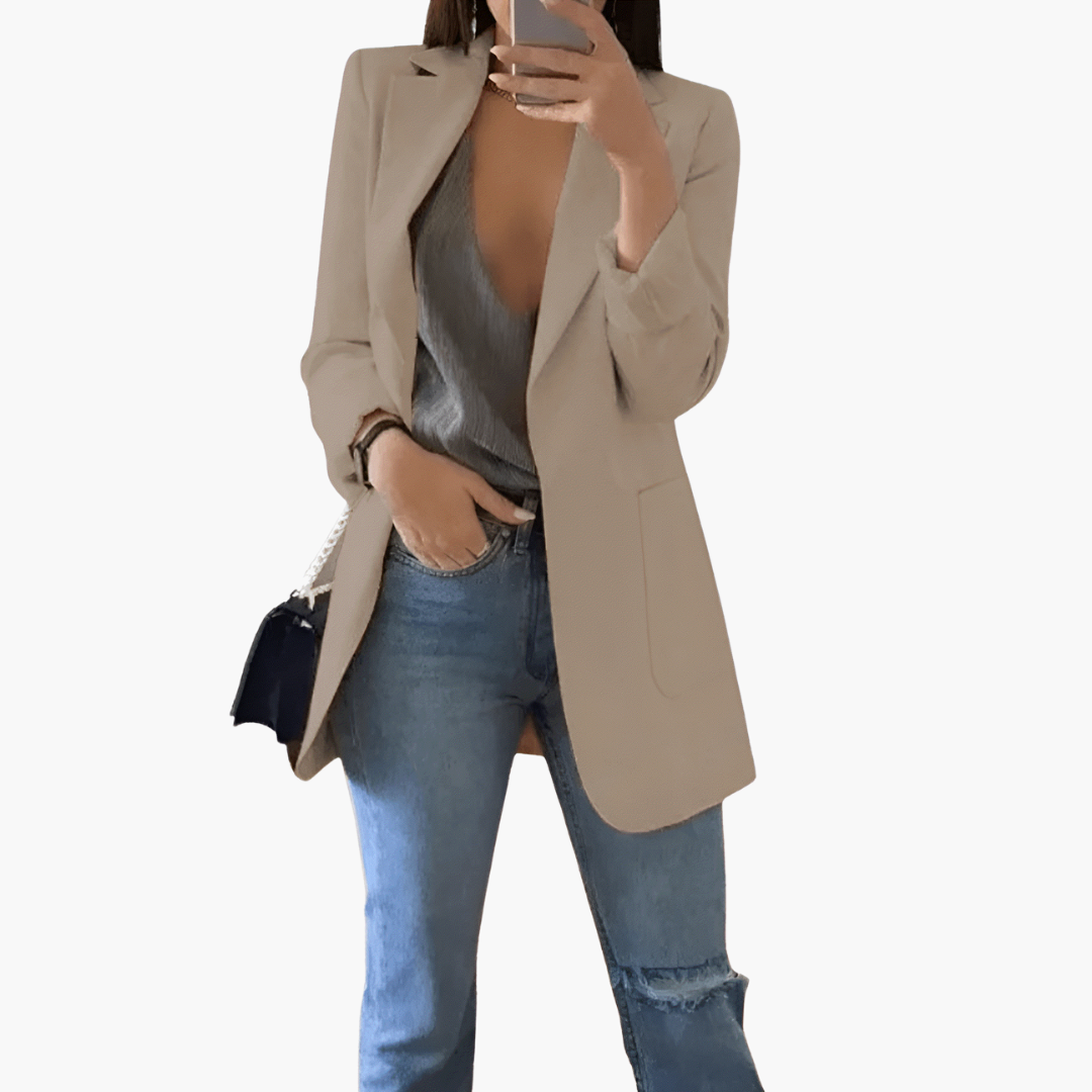 Women's open front blazer with structured lapel, long sleeves, pockets, polished professional style