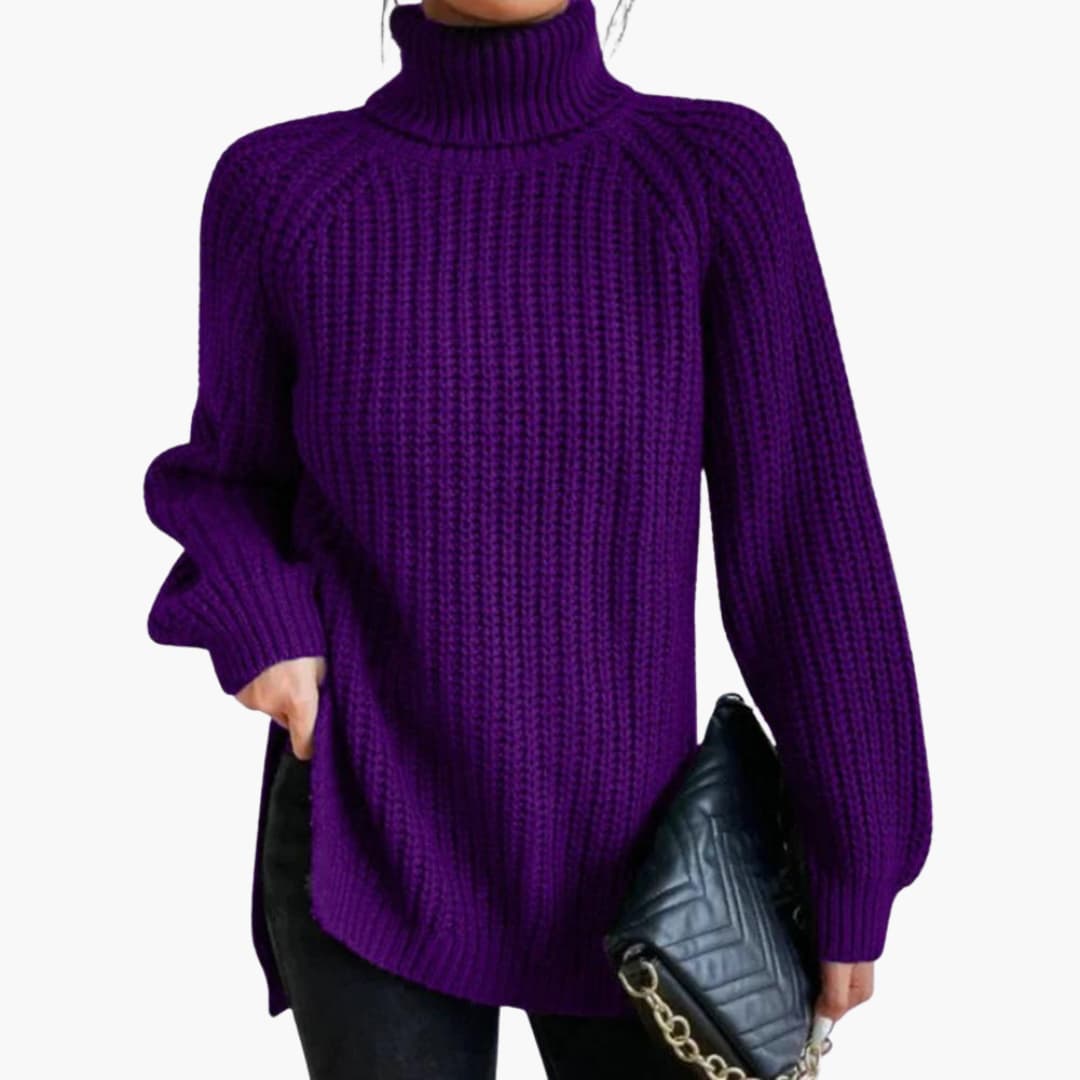 Women's loose cream turtleneck sweater with dropped shoulders and relaxed cozy fit