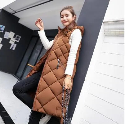 Women's long quilted hooded vest in neutral tones, sleeveless winter layering piece with textured stitching