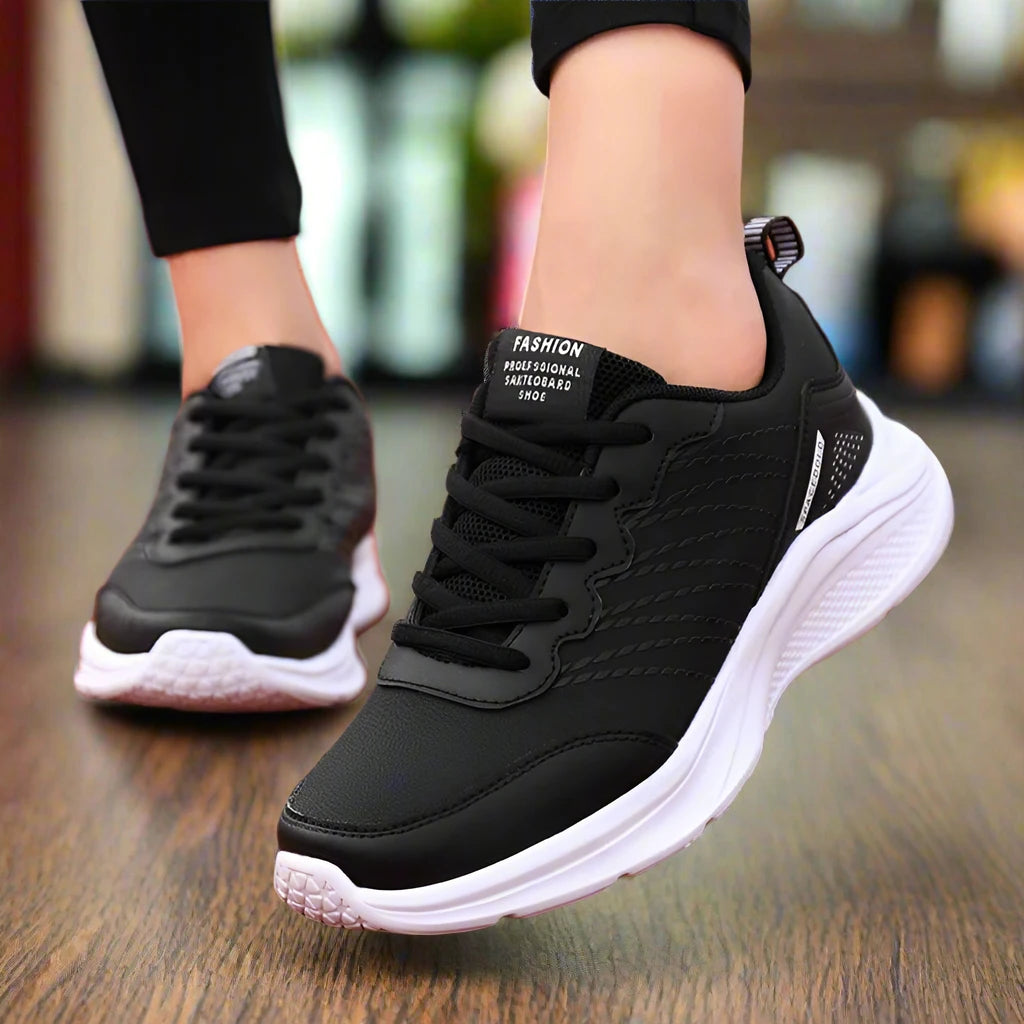 Women's white lightweight lace-up sneakers with breathable mesh and cushioned sole for all-day comfort