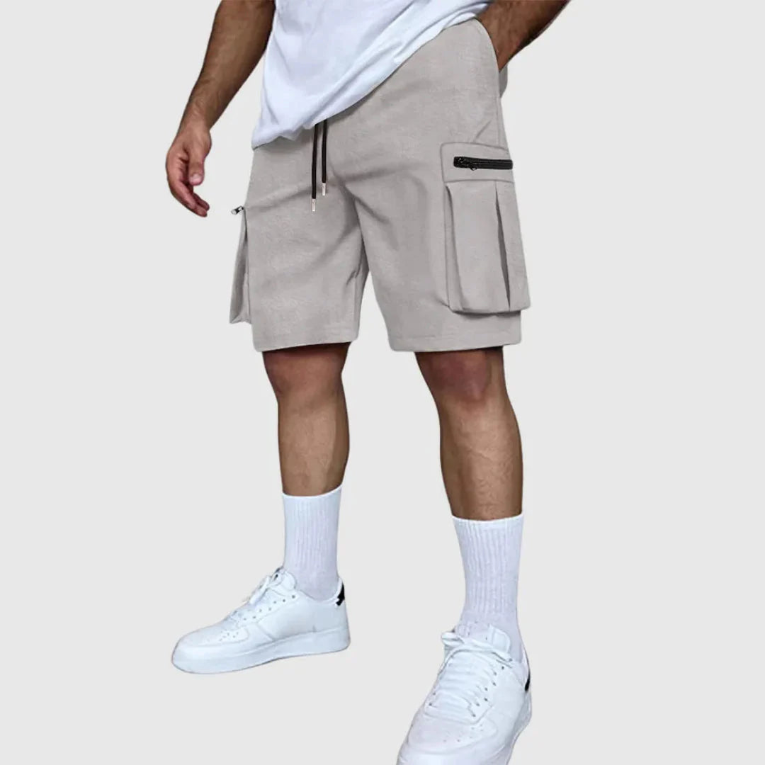 Men's khaki multi-pocket utility cargo shorts with secure zip pockets and breathable poly-blend fabric