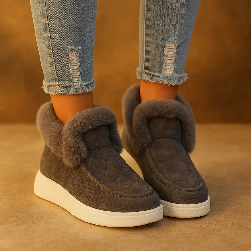 Women's cozy suede slip-on winter boots with plush faux fur lining in warm neutral tones