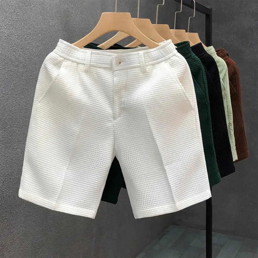 Men's solid color textured woven cotton shorts with structured fit for breathable summer comfort