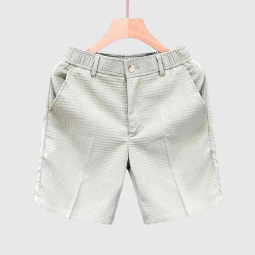 Men's solid color textured woven cotton shorts with structured fit for breathable summer comfort
