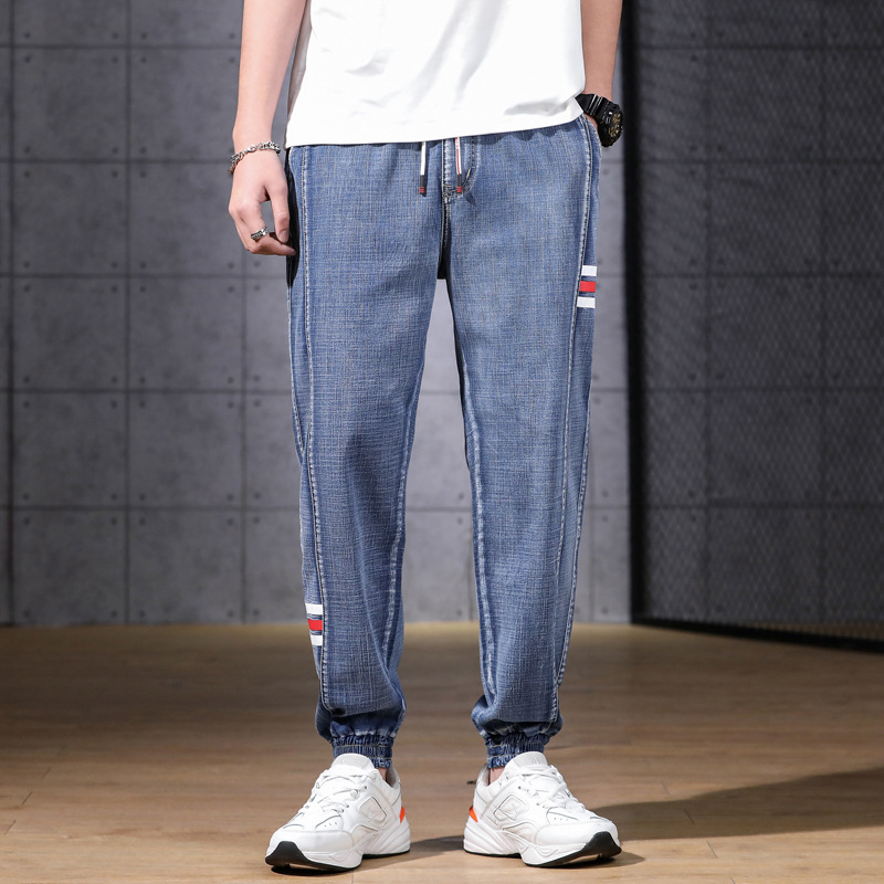 Men's light blue denim cargo joggers elastic waistband striped accents lightweight relaxed fit
