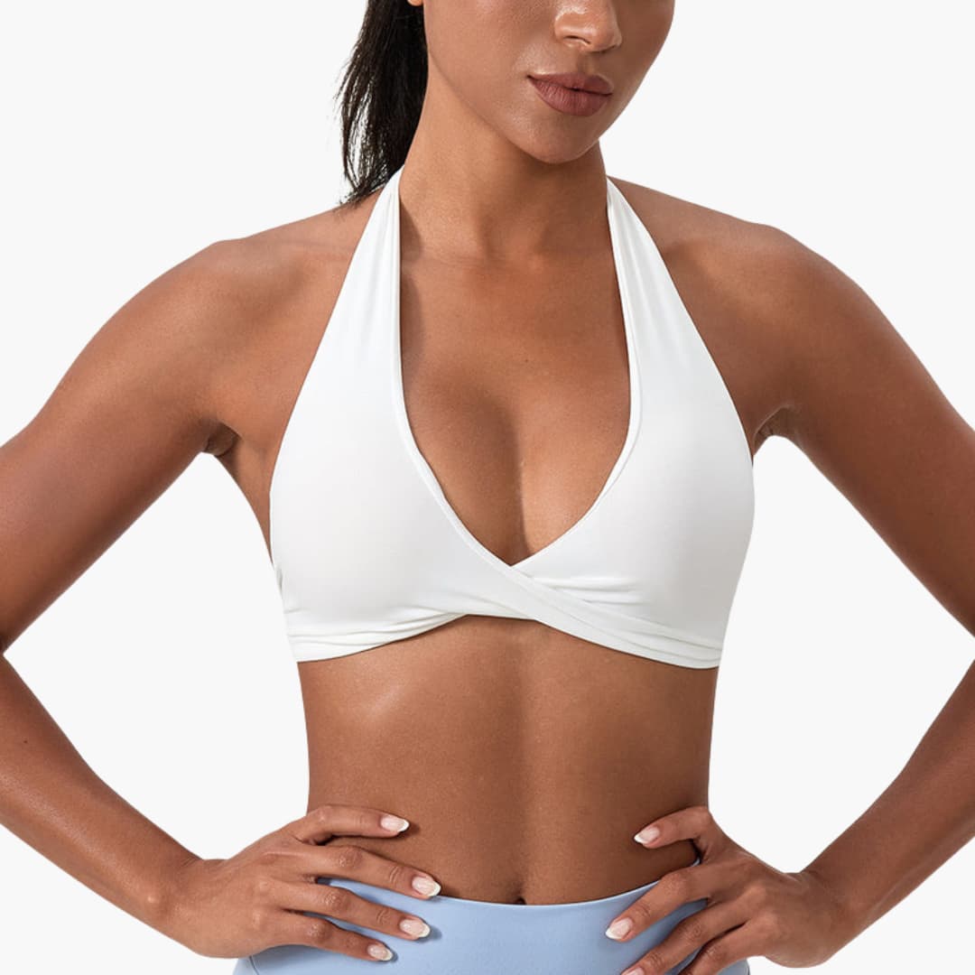 Women's sleeveless high-neck sports tank top with fixed collar, support band, and smooth surface