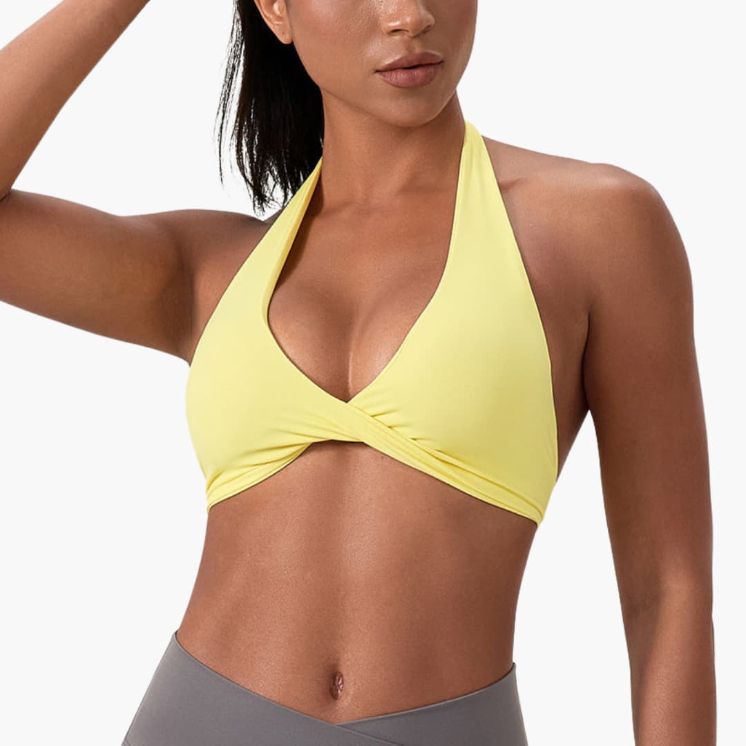 Women's high-neck sleeveless sports tank top with fixed collar, support band, and smooth surface