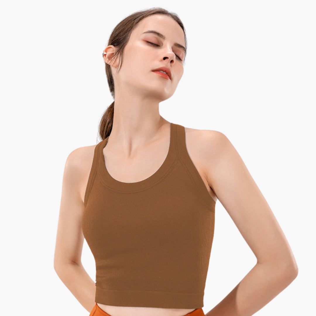 Women's fitted ribbed sleeveless sports tank top in racerback style for training comfort