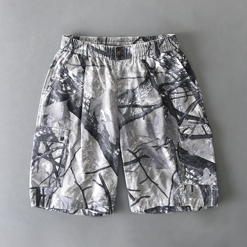 Men's distressed camo cargo shorts with elastic waist, dual button flap pockets, relaxed fit