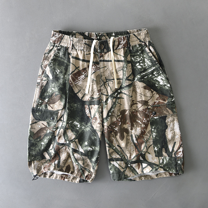 Men's distressed camo cargo shorts with elastic waist, dual button flap pockets, relaxed fit
