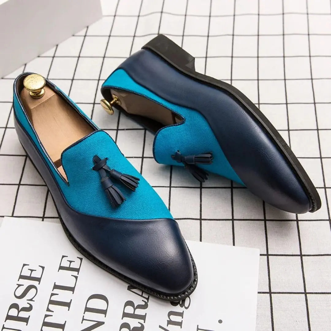 Men's two-tone navy blue tassel loafers with cushioned insole and sleek silhouette