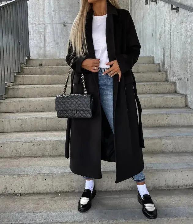 Women's double-breasted winter coat with waist-cinching belt, structured silhouette, classic elegant style