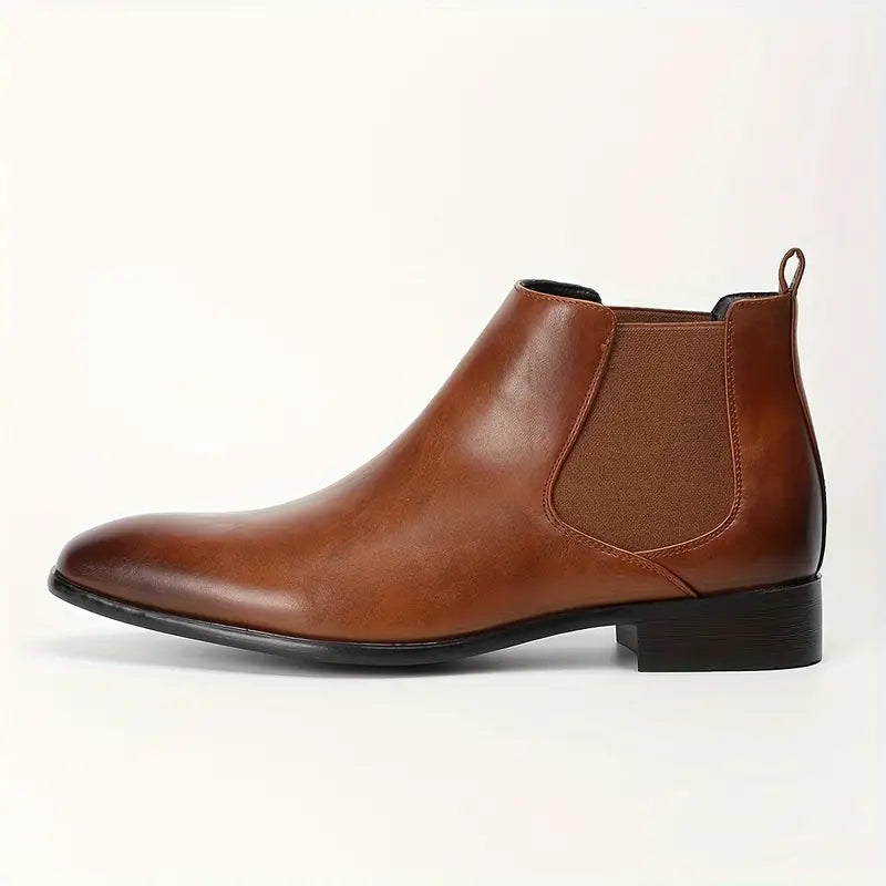 Black pointed-toe Chelsea boots with elastic panels and cushioned insole for everyday professional style