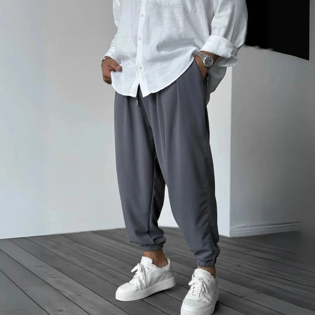 Men's tapered joggers pleated front elastic cuffs soft flowing fabric smart-casual relaxed fit