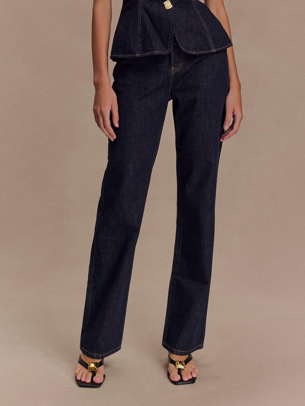 Women's blue denim sleeveless button-down vest top and high-waist straight jeans set with irregular buttons