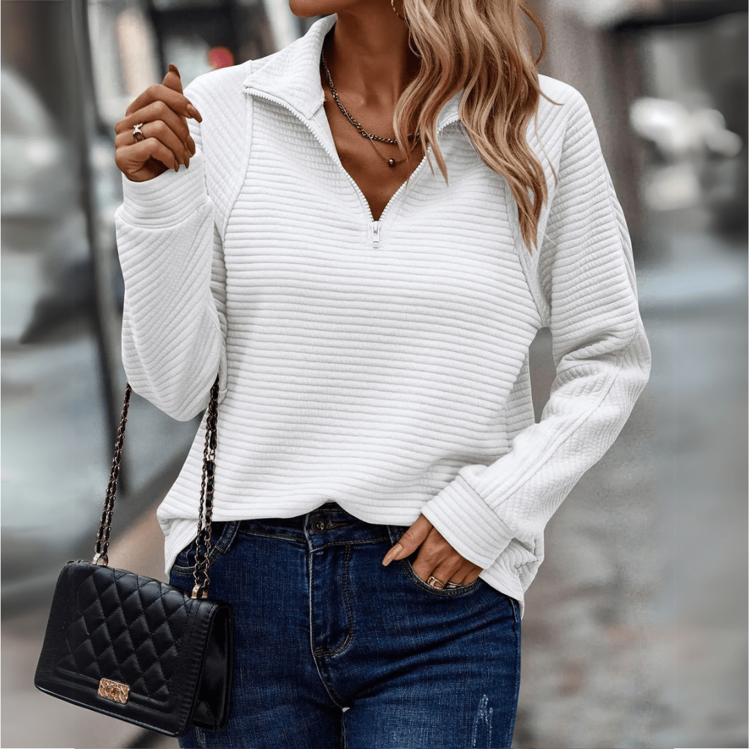Women's ribbed half-zip pullover sweater with soft knit texture and minimalist everyday style